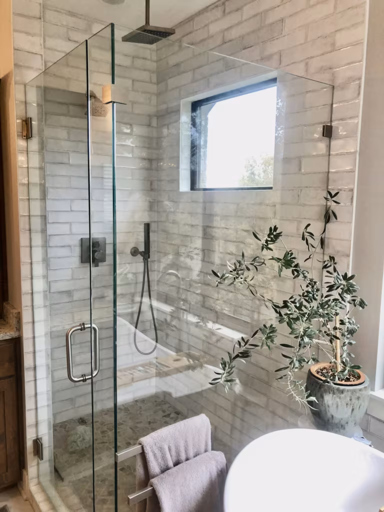 Bathroom with a clear glass shower door and vanity unit