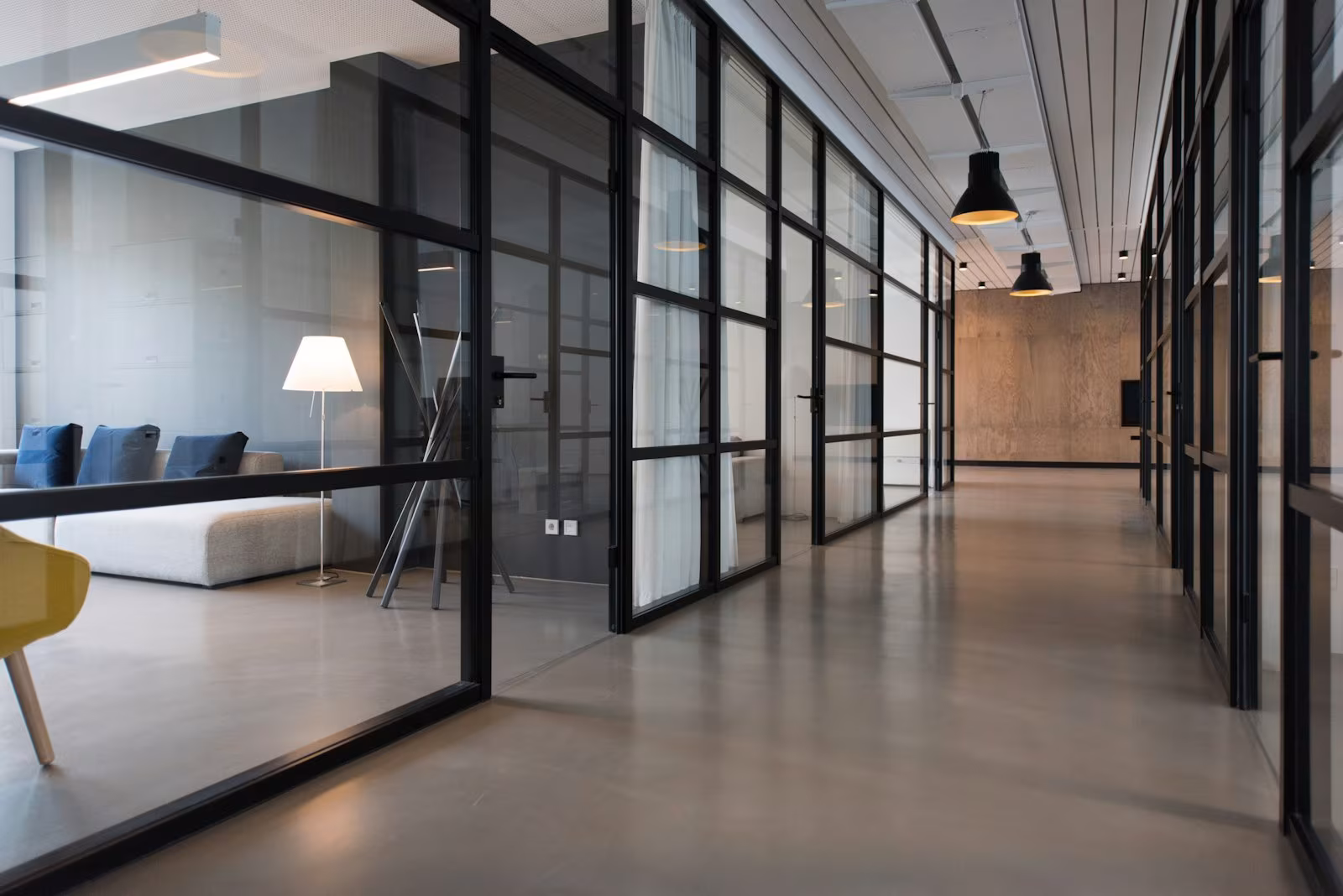 Glass doors along an office corridor