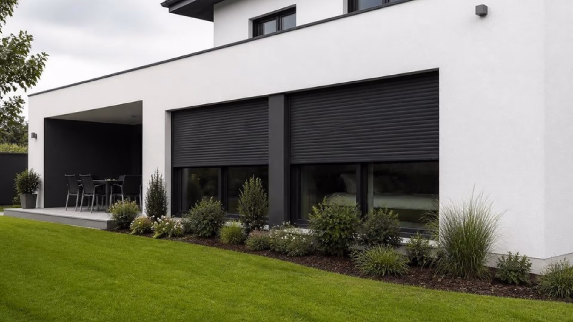 Anthracite aluminium roller shutters on the windows of a modern house