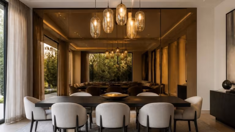 Bronze tinted mirror panels on a dining room wall