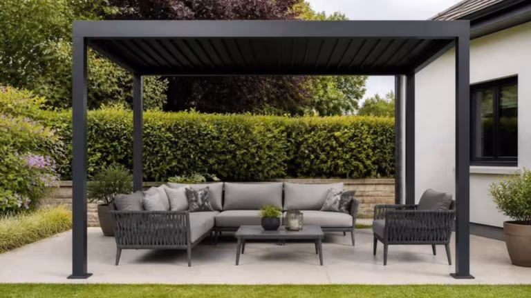 Freestanding aluminium pergola with a fixed slatted roof over a seating area