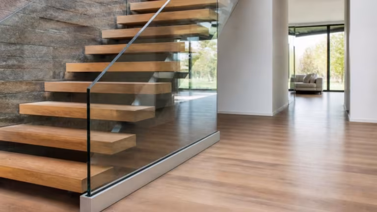 Frameless glass balustrade on an oak staircase