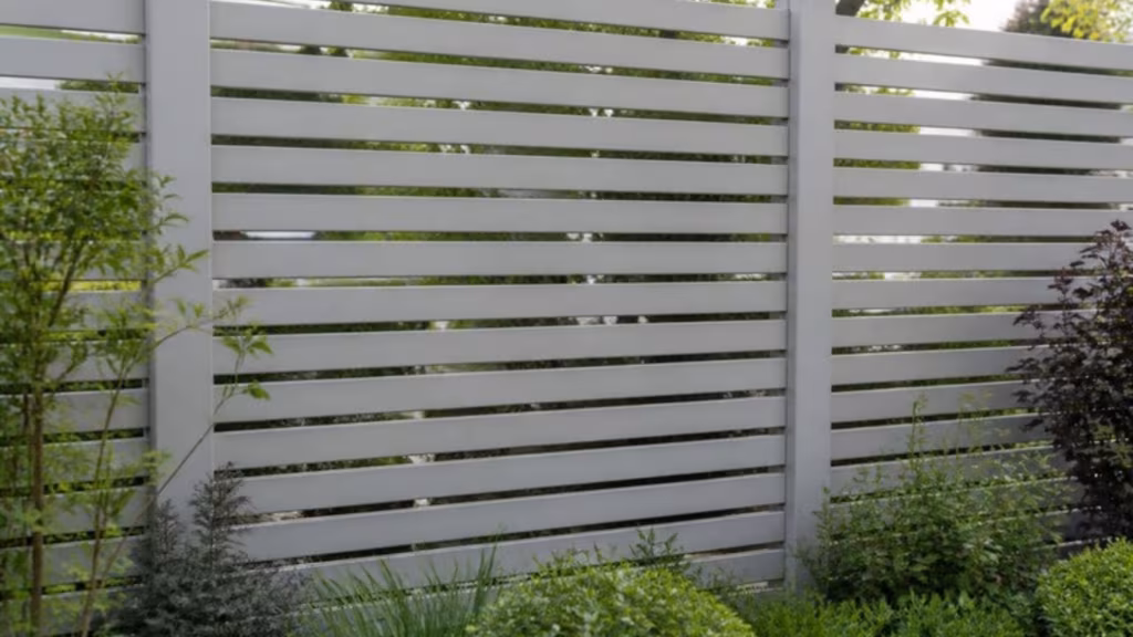 Close-up of grey horizontal aluminium fence slats with even gaps