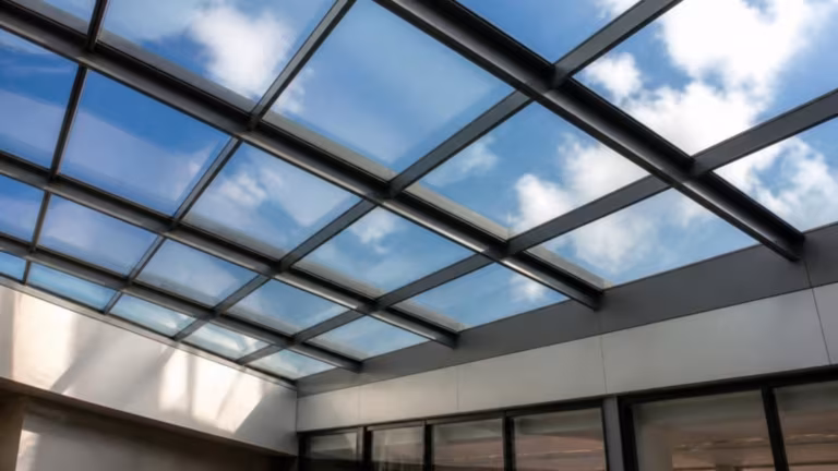 Laminated glass roof panels over a modern atrium