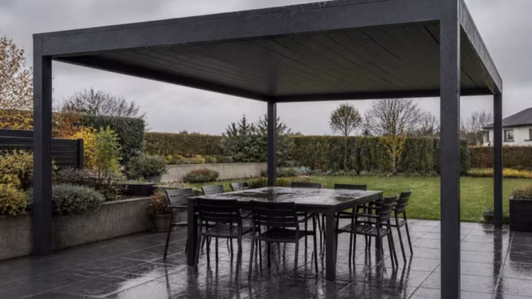 Louvred pergola closed in the rain over a dry dining table