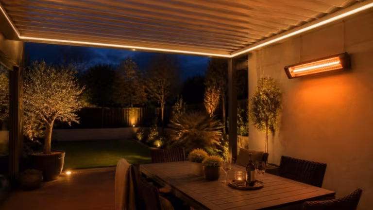 Louvred pergola at dusk with LED lighting and an infrared heater