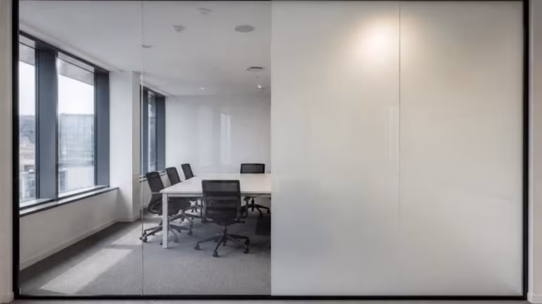 Smart glass partition half clear and half switched to opaque