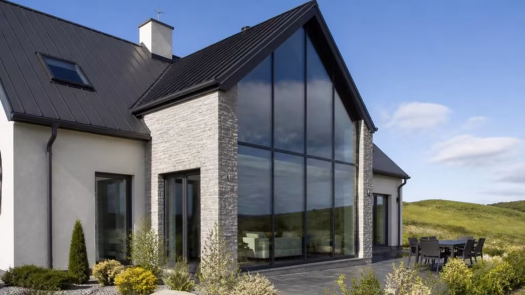 House with a large south-facing glazed gable in solar control glass