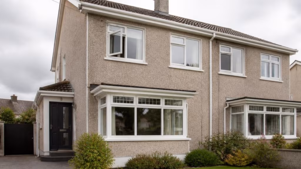 Semi-detached house with white aluminium casement windows, one sash open
